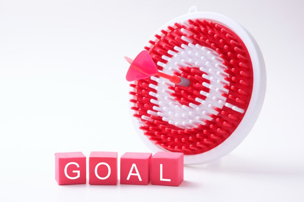 Goal wording with red dart and dartboard